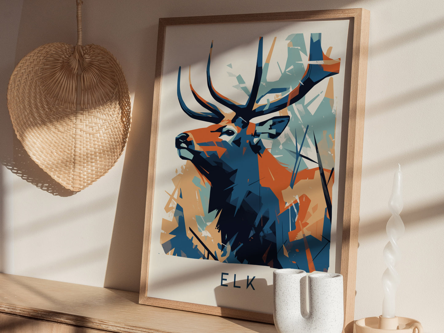 Framed elk geometric wall art in vibrant blue, orange, and teal, showcasing abstract wildlife art for nature lovers.