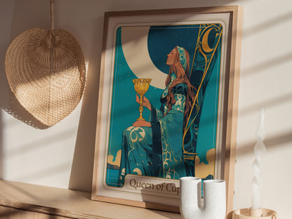 A beautifully framed art print titled Queen of Cups depicts a serene woman holding a golden chalice, seated under a crescent moon.