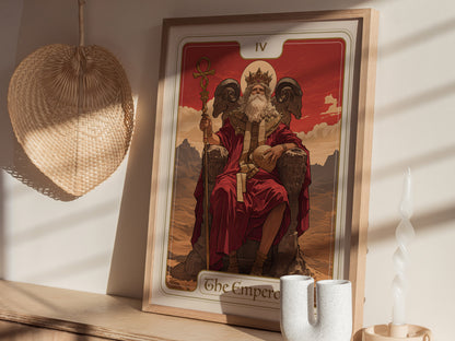 A framed Emperor Tarot Card poster featuring a bearded figure in red robes, seated on a throne with ram-head armrests. The scene includes a woven basket and decorative candle.