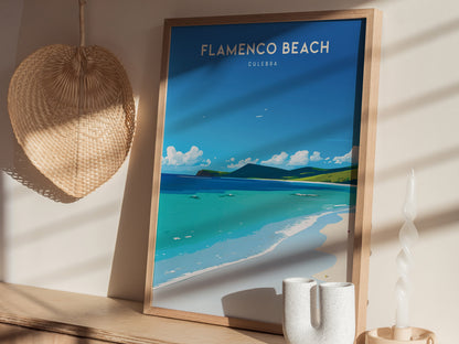 A framed poster of Flamenco Beach in Culebra, Puerto Rico, is displayed against a wall with a woven basket and decorative candle nearby. Sunlight creates soft shadows.
