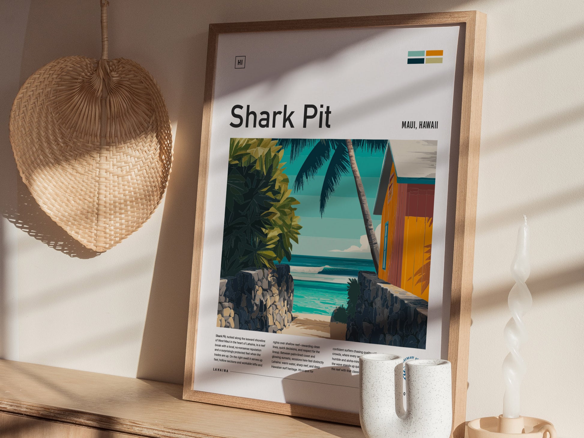 A framed art print titled Shark Pit featuring a vibrant beach scene in Maui, Hawaii. The illustration showcases a colorful coastal house, lush greenery, and gentle waves under a clear blue sky, with soft shadows cast by sunlight.
