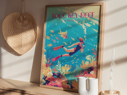 A framed poster of a vibrant underwater scene featuring a snorkeler, colorful coral, and tropical fish is displayed on a wooden shelf beside a woven wall decoration and decorative objects.