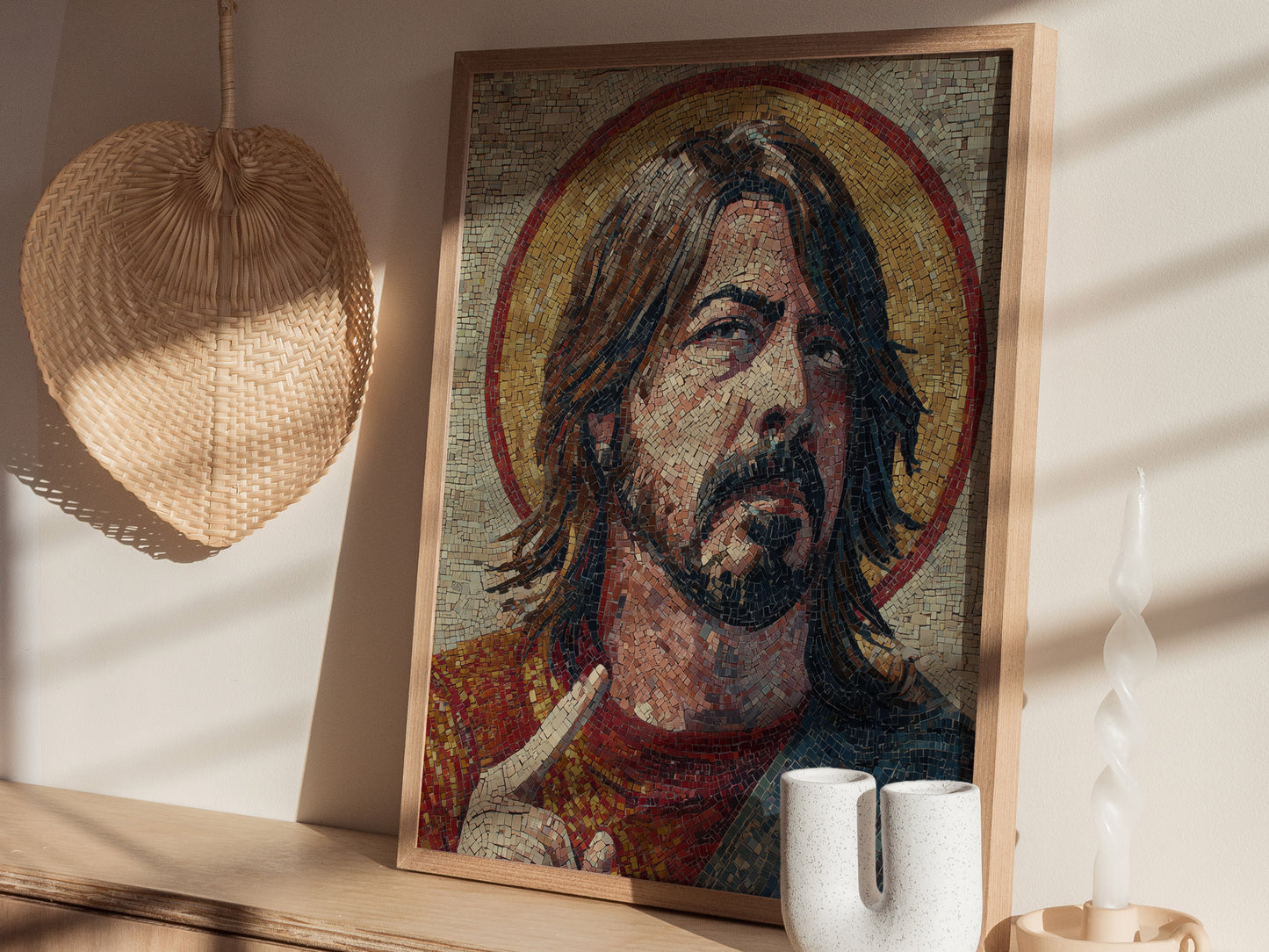 A detailed mosaic artwork depicting a man with long hair and a beard, styled in a Byzantine iconography. The piece features rich colors and textures, framed elegantly, and is illuminated by natural light from nearby windows.