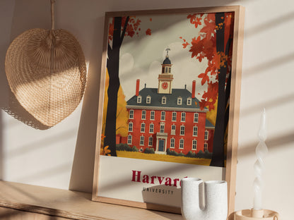 A framed poster of a classic red-brick building with autumn trees, labeled Harvard University, is displayed on a shelf with decorative items, including a woven fan and a candle.