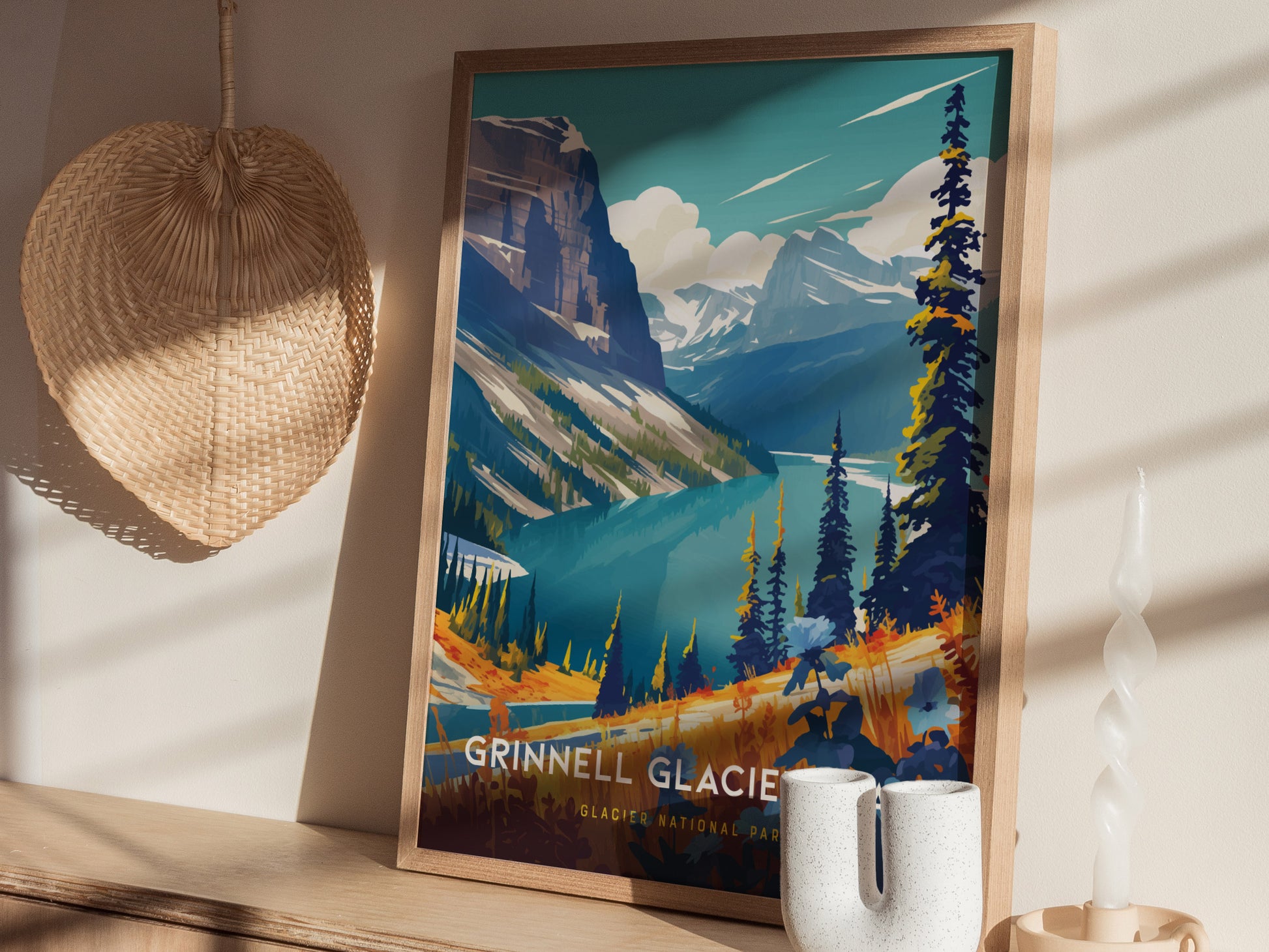 A framed poster of Grinnell Glacier Trail in Glacier National Park is displayed on a wooden shelf, accompanied by a wicker fan and decorative ceramic items.
