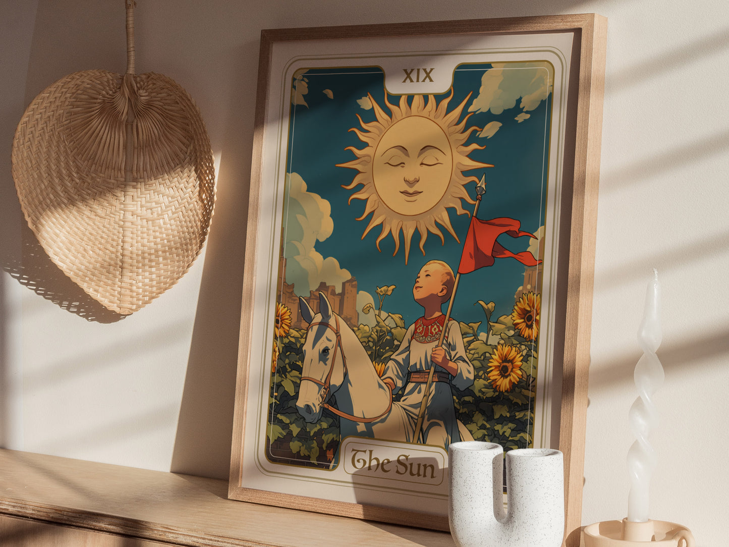 A framed tarot card poster of The Sun features a child on a white horse, surrounded by sunflowers under a radiant sun. Decorative items and shadows enhance the scene.