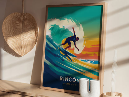 A vibrant Rincon Puerto Rico surf poster featuring a surfer riding a wave, set against a colorful sunset. The artwork is displayed in a wooden frame on a shelf.