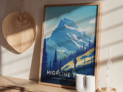 A framed poster of the Highline Trail in Glacier National Park is displayed on a shelf with sunlight casting shadows. A wicker decoration and a spiral candle are nearby.