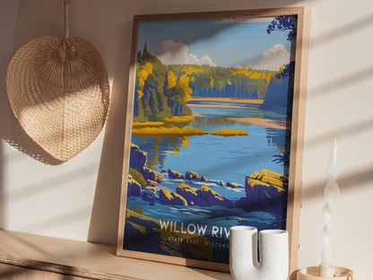 A framed art print featuring a serene landscape of Willow River State Park in Wisconsin. The scene showcases a calm blue river surrounded by lush green trees and rocky shores, with soft clouds drifting in a bright sky.