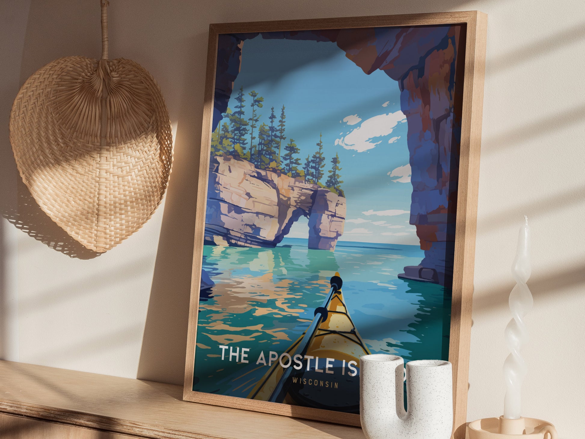 A beautifully framed poster depicts a scenic view of the Apostle Islands in Wisconsin, showcasing a vibrant landscape of rocky cliffs and calm waters.