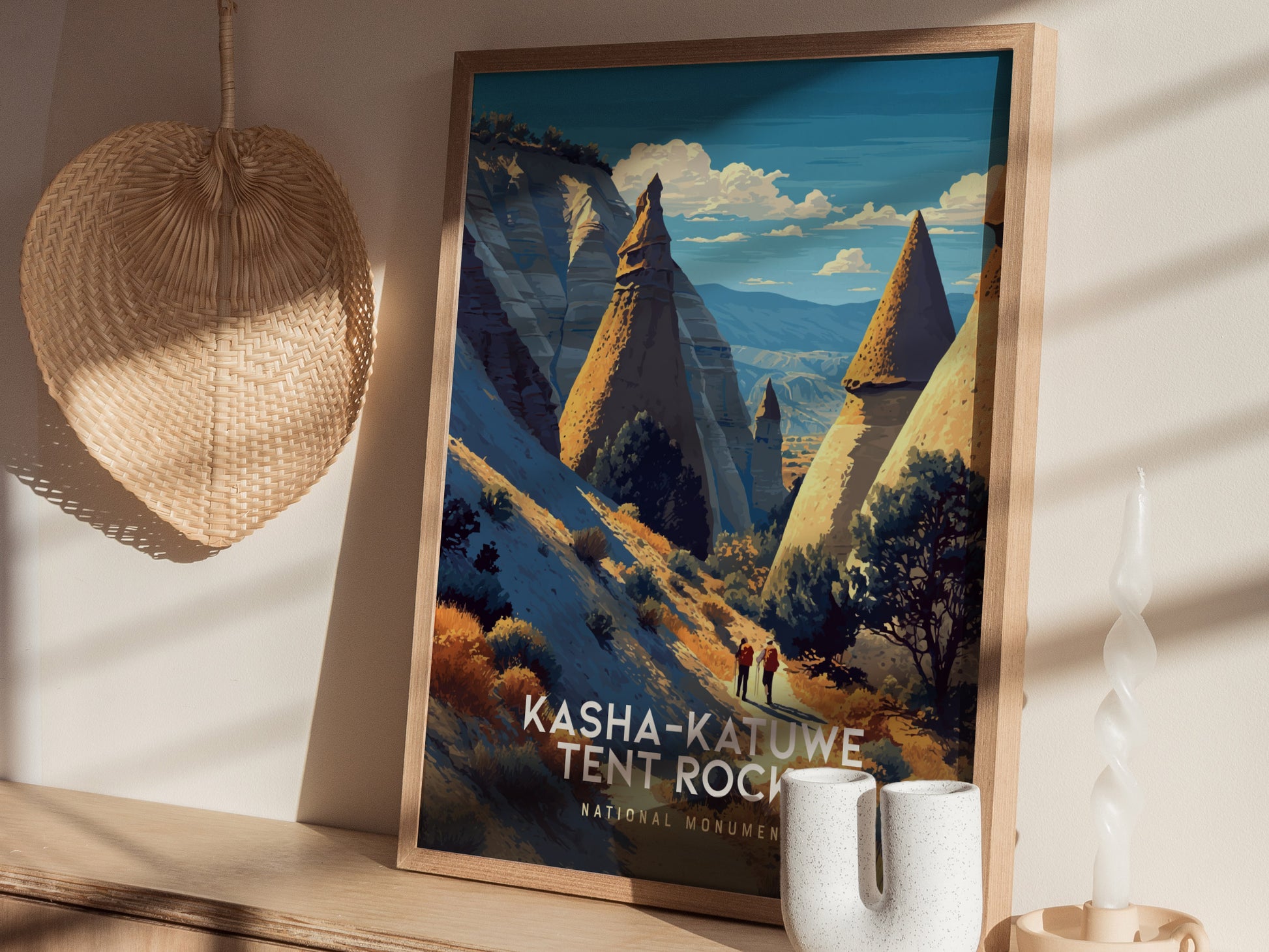 A vintage travel print features the Kasha-Katuwe Tent Rocks National Monument, showcasing unique cone-shaped rock formations under a blue sky.