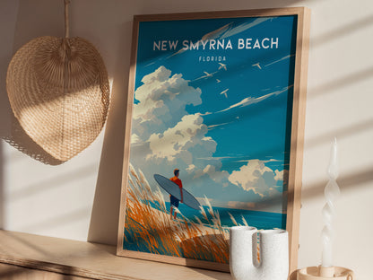 A framed New Smyrna Beach poster featuring a surfer holding a board, set against a vibrant sky and ocean. The scene is accentuated by beach grass.