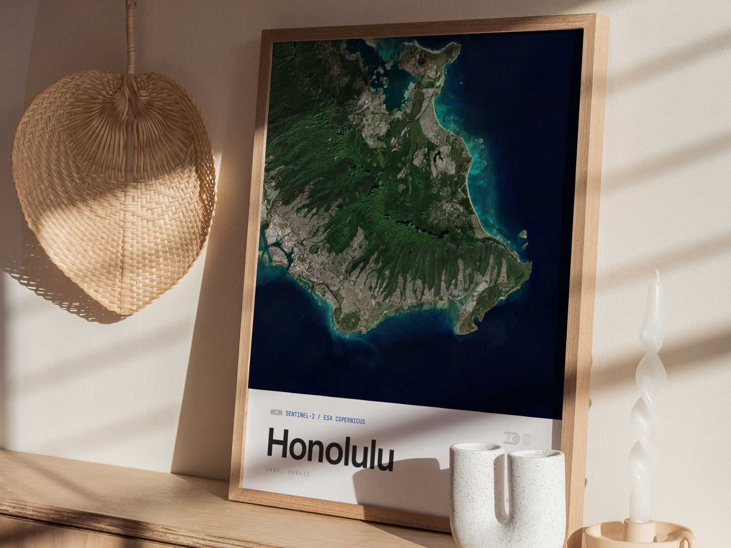 A framed art print of a satellite image showcasing the island of Honolulu, featuring lush green landscapes, coastal areas, and clear blue waters.