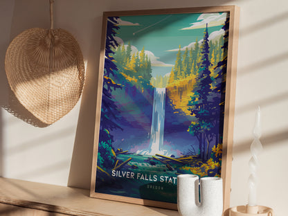 A framed poster of Silver Falls State Park is displayed on a wooden shelf, depicting a waterfall amidst lush greenery. A woven basket and decorative candle are nearby.