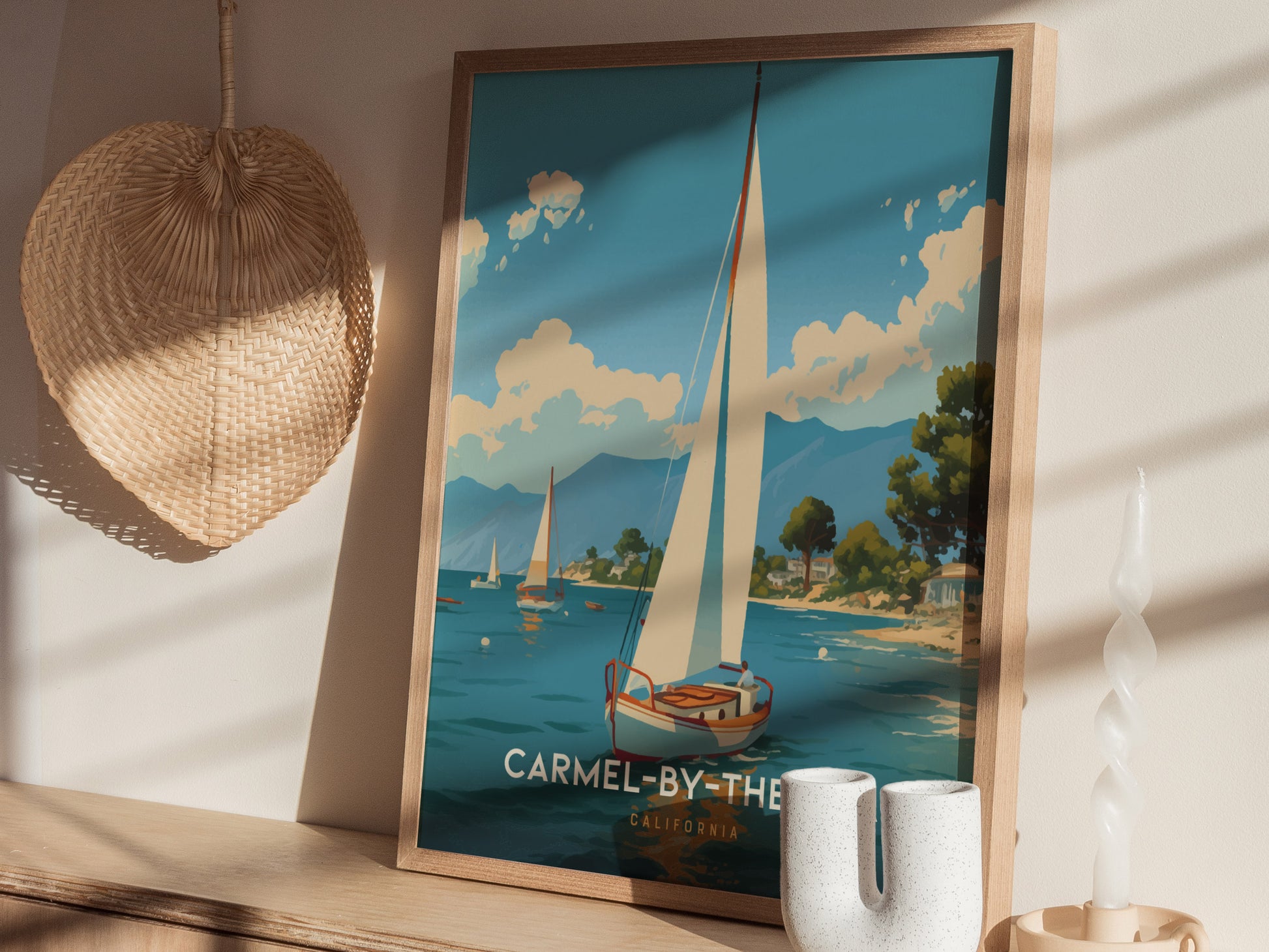 A framed poster of a sailboat on blue water is displayed on a wooden shelf, alongside decorative items and a woven straw hat on the wall.