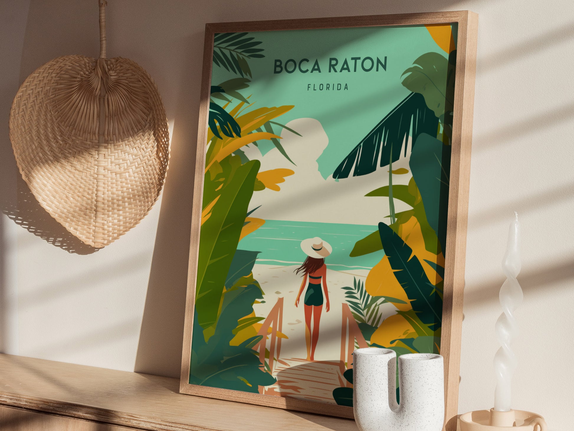 Framed artwork depicts a woman in a hat walking on a beach path surrounded by tropical plants, with Boca Raton, Florida text above.