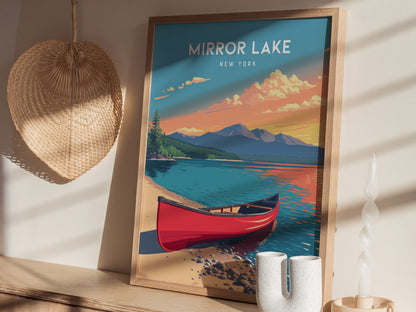 A colorful poster of Mirror Lake, New York, featuring a serene landscape with a red canoe on the shoreline. The backdrop includes mountains, evergreen trees, and a vibrant sunset sky, all beautifully framed in a wooden border.