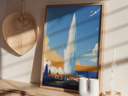 A framed poster of Old Faithful Geyser is displayed on a wooden shelf, accompanied by a woven basket and a white twisted candle, bathed in soft sunlight.