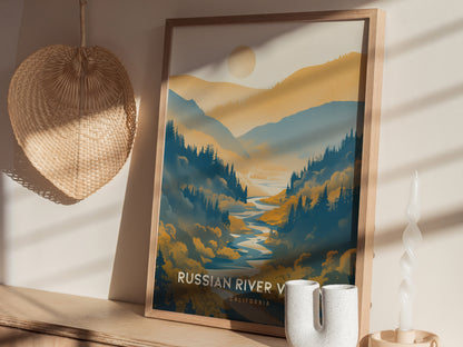 Framed poster of Russian River Valley depicting lush blue and golden hills, with a sun above. It rests on a wooden shelf beside ceramic vases and a woven wall decoration.