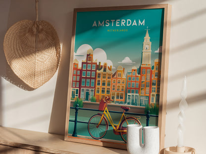Framed Amsterdam wall art featuring vibrant canal houses, a bicycle in the foreground, and a clock tower, perfect travel print.