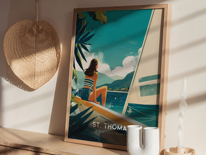 A framed St. Thomas travel poster with a woman on a sailboat is displayed on a shelf, accompanied by a woven wall decor and a decorative candle.