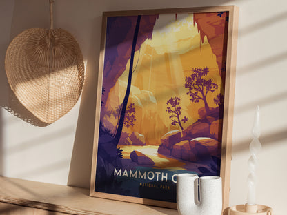 Framed Mammoth Cave National Park poster featuring an illustrated cave scene with trees and sunlight. Displayed on a shelf with a woven fan, ceramic vase, and spiral candle.