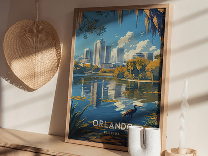 Framed poster depicting Orlandos downtown skyline and Lake Eola with palm trees and a heron, placed on a wooden shelf next to a woven fan and a candle.