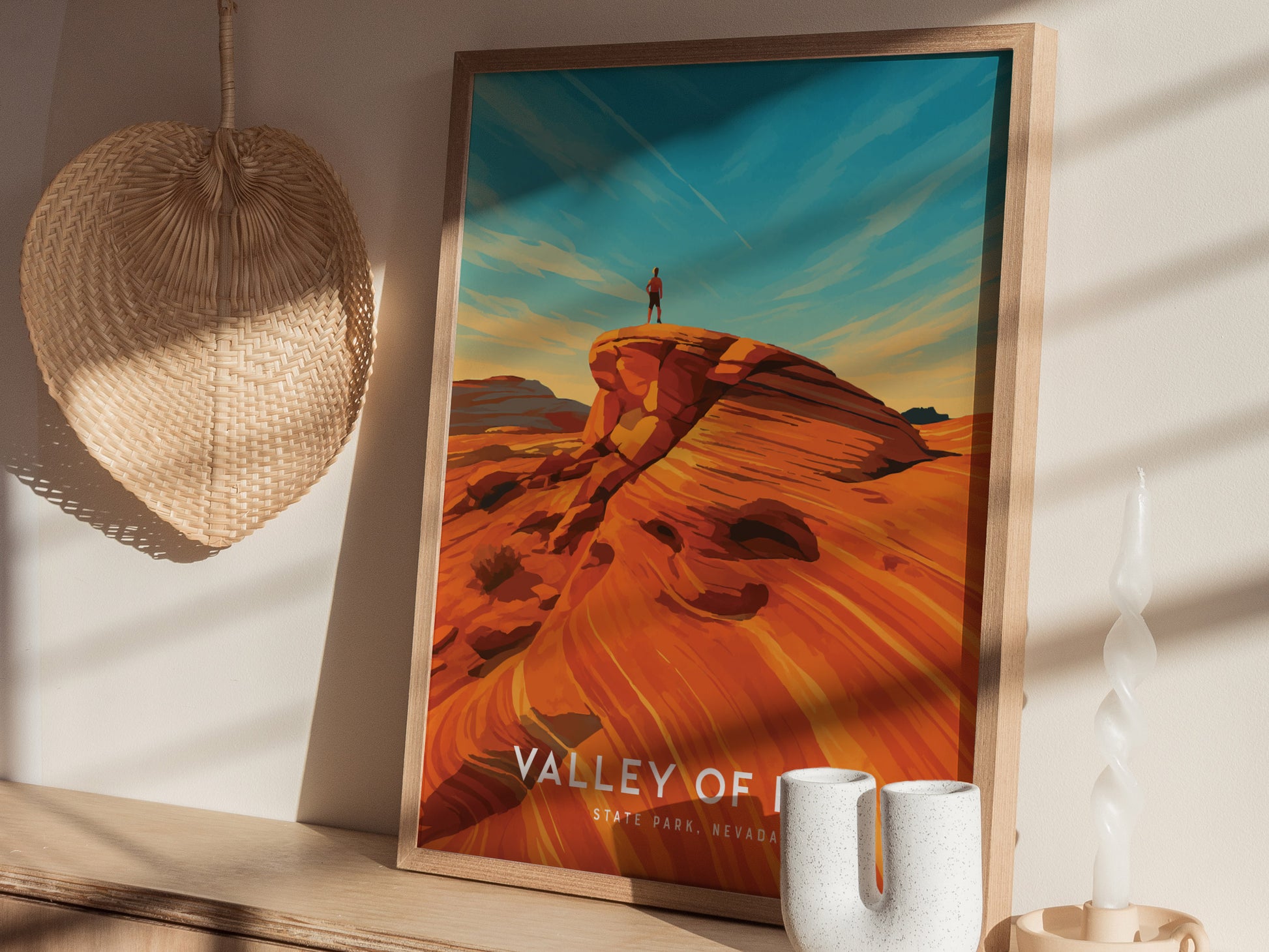 A framed travel print titled Valley of Fire State Park, Nevada features a vibrant landscape with striking red rock formations under a blue sky.