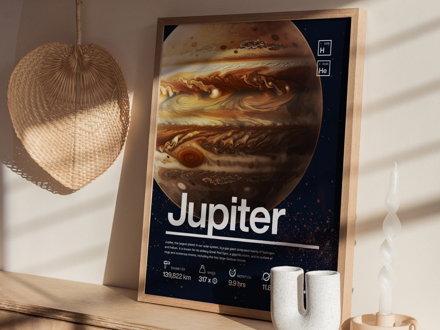 A framed Jupiter poster featuring detailed swirling clouds and the Great Red Spot rests on a shelf, alongside a woven wall decor and a white spiral candle.