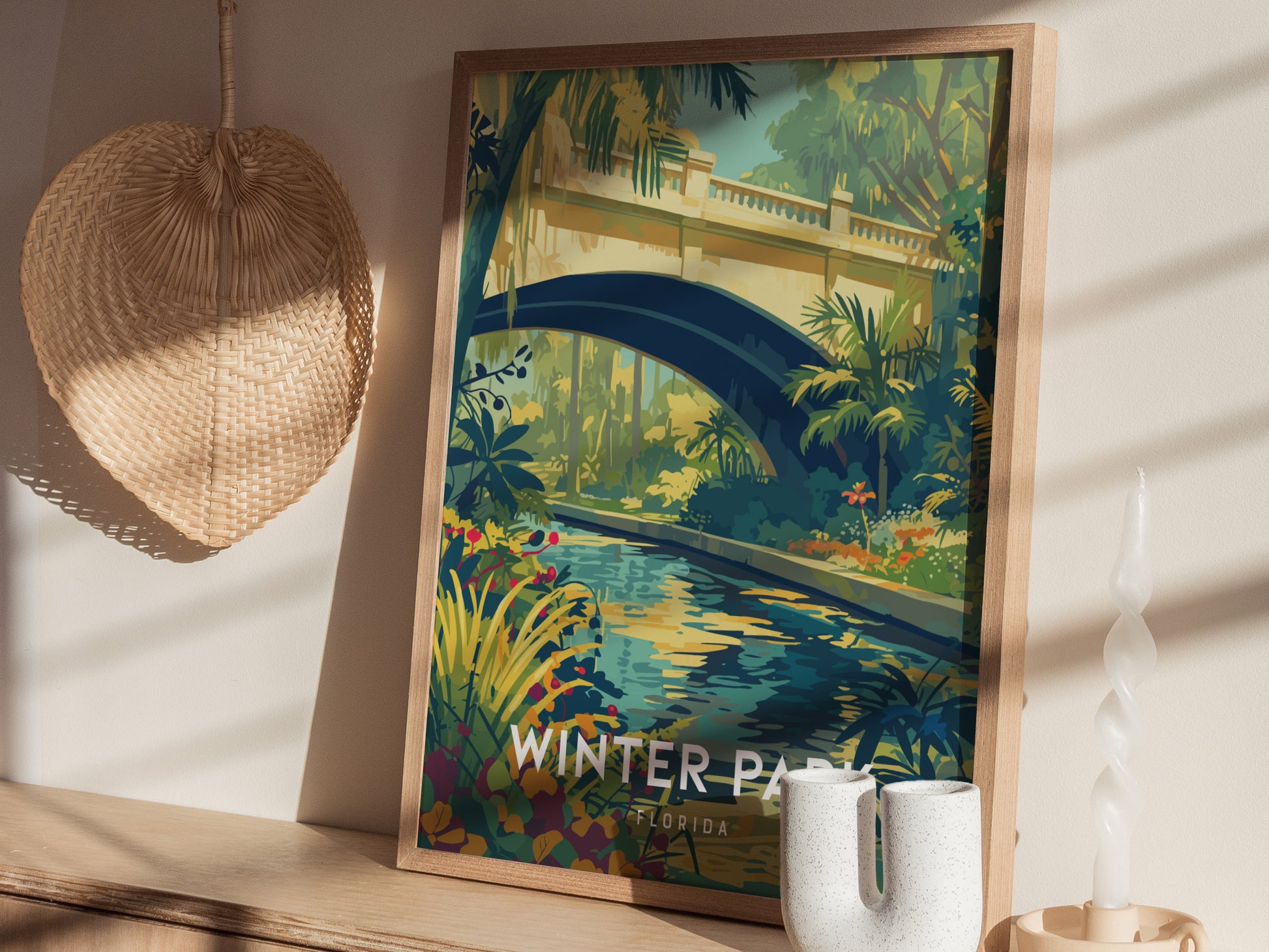 A framed poster depicting a scenic bridge over a lush garden stream is displayed on a wooden shelf with decorative items, including a woven basket and a ceramic vase.