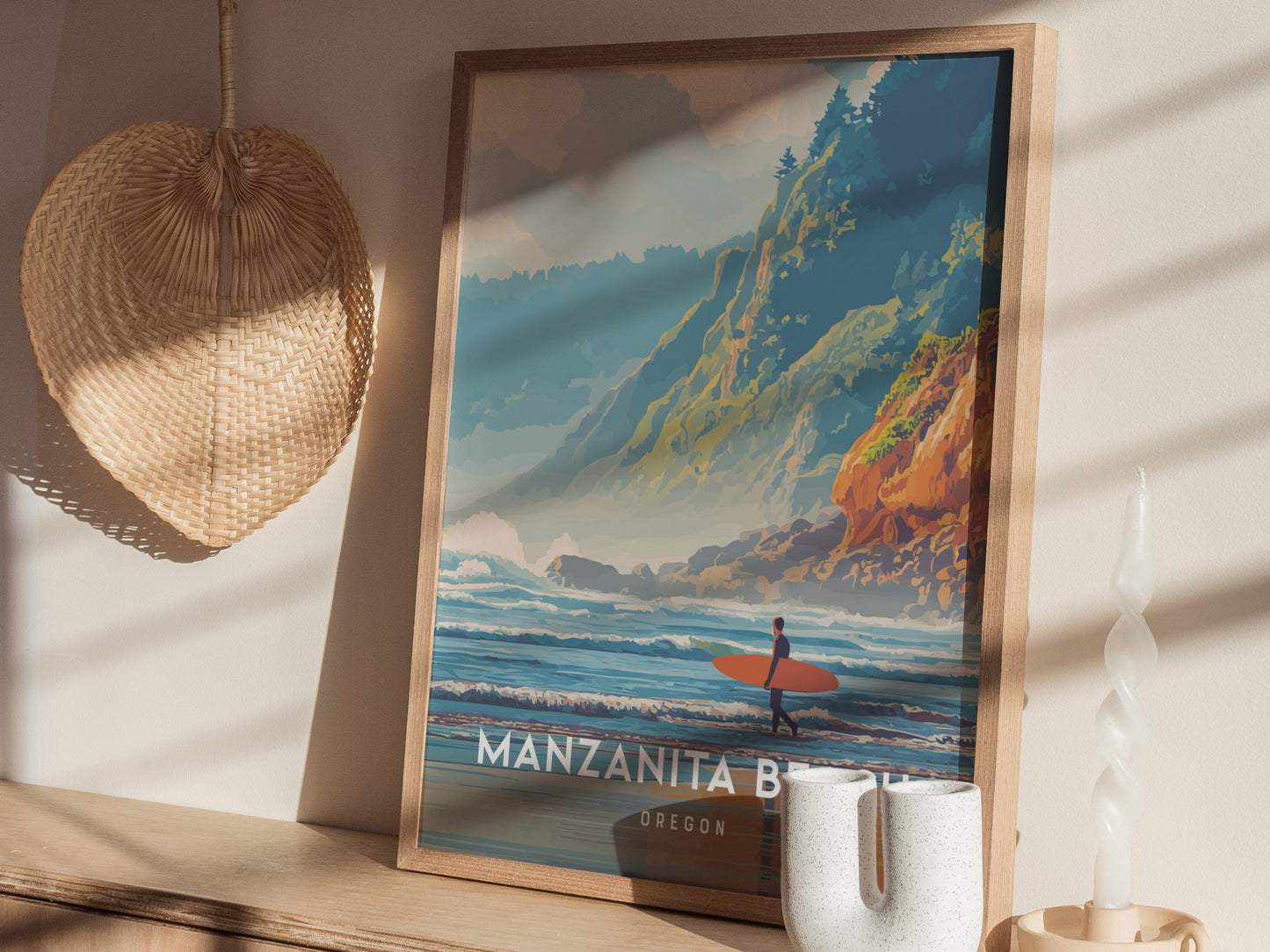 A beautifully framed poster of Manzanita Beach, Oregon, featuring a surfer standing on the shore against a backdrop of rugged cliffs and rolling waves. The vibrant colors and artistic style evoke the coastal beauty of the area.