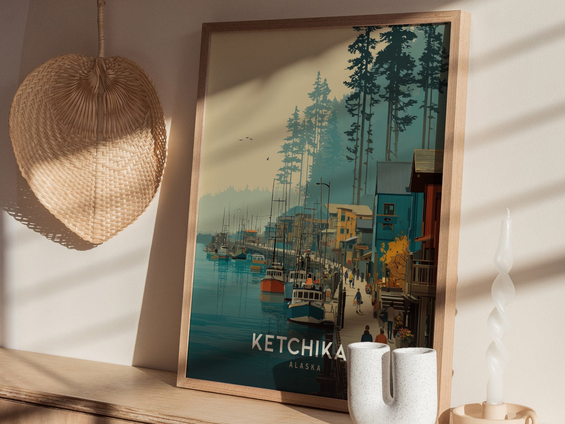 A framed vintage travel print of Ketchikan, Alaska, displays a scenic waterfront bustling with boats and people. Tall trees and a pastel sky create a serene backdrop, enhancing the charm of this picturesque coastal town.