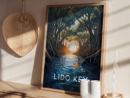 A framed poster depicting a serene mangrove scene with water reflecting sunlight is placed on a shelf beside a woven wall decoration and decorative candles.