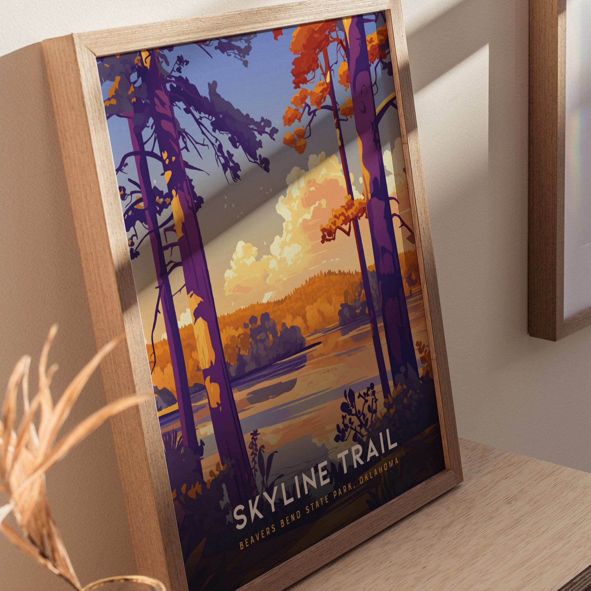 Framed artwork featuring a vibrant landscape of Beavers Bend State Park with colorful trees and a scenic sky. The text reads Skyline Trail, Beavers Bend State Park, Oklahoma.