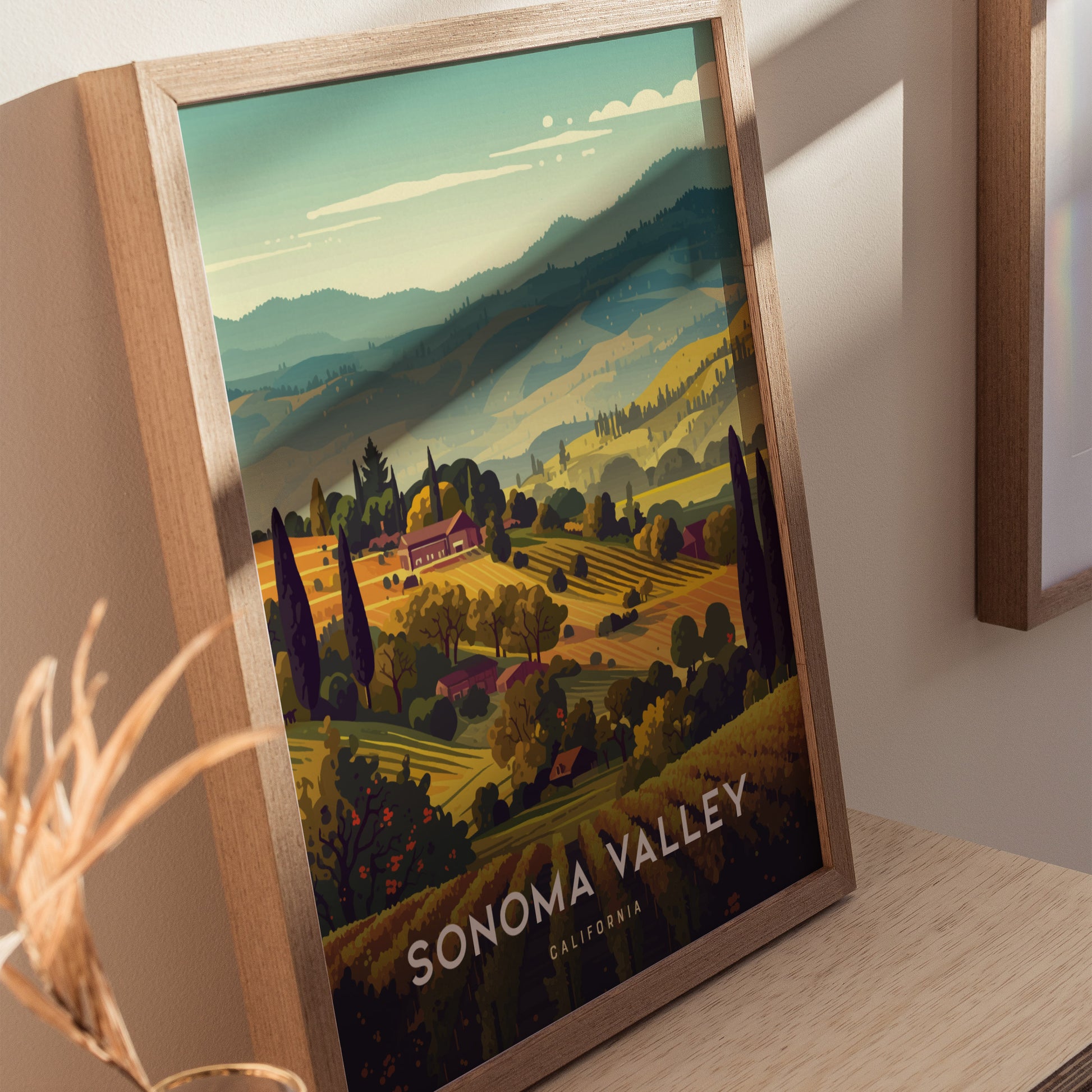 Framed poster of Sonoma Valley features rolling vineyard hills, lush greenery, and a warm color palette, capturing the serene beauty of Californias wine country. Text reads Sonoma Valley California.