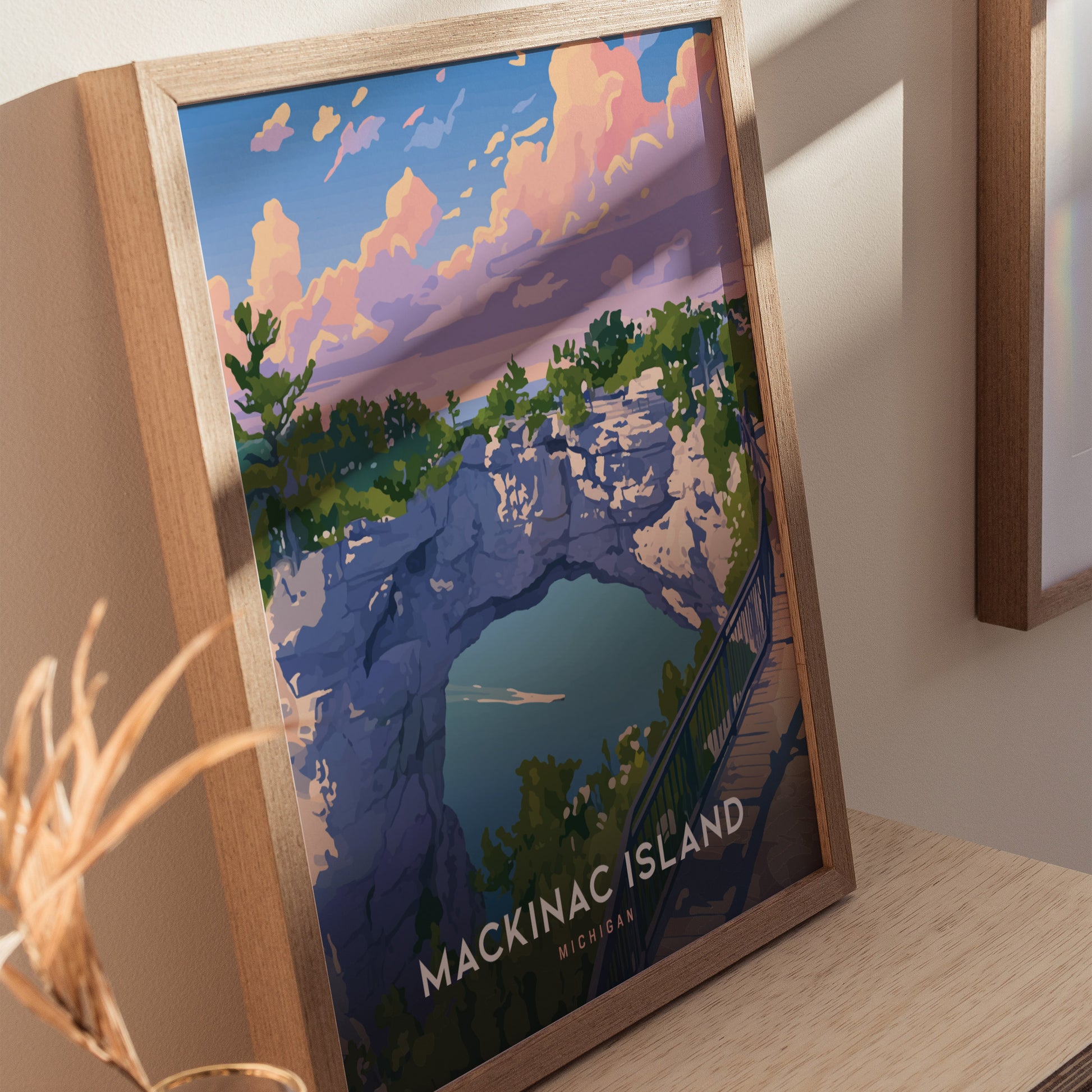 Framed poster of Mackinac Island Arch Rock, featuring vibrant colors and a design-forward style, showcasing the limestone arch, lush greenery, and a serene blue lake.