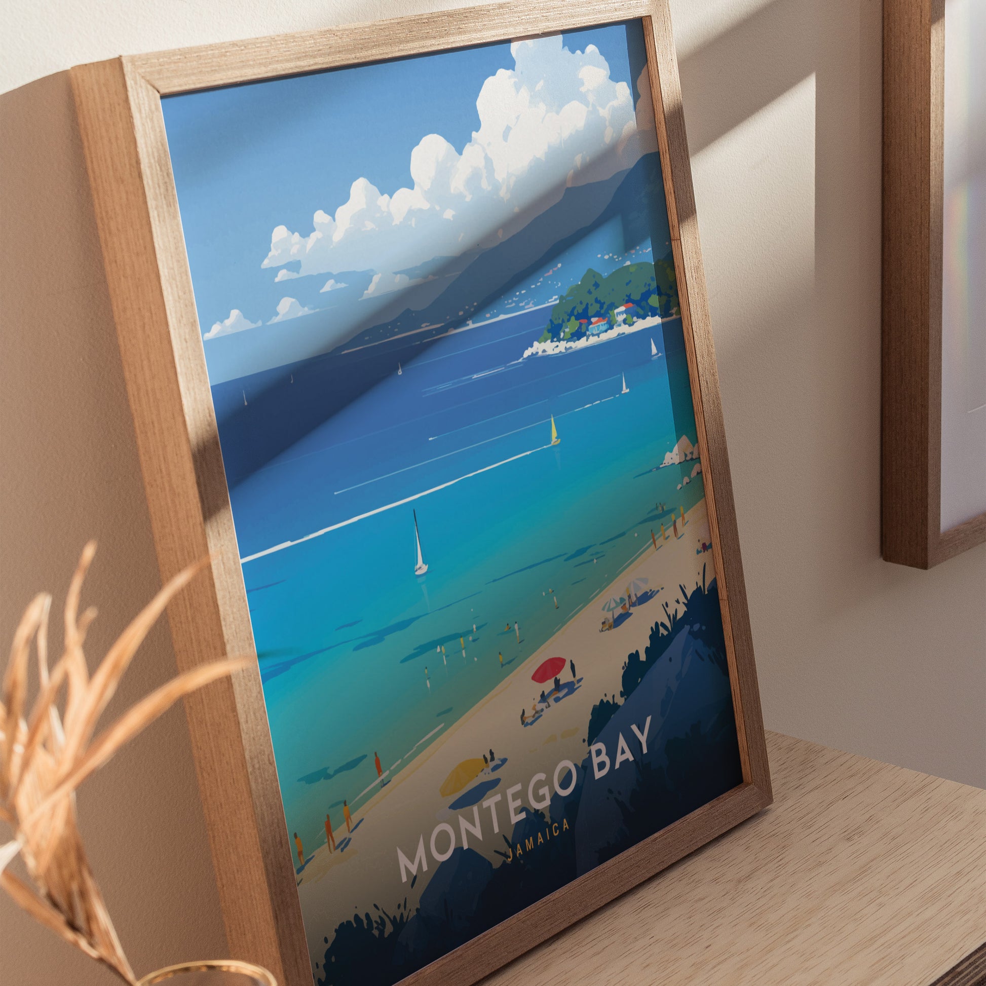 Framed Montego Bay poster featuring a vibrant beach scene with turquoise waters, sailboats, and a sandy shore under a blue sky with clouds.