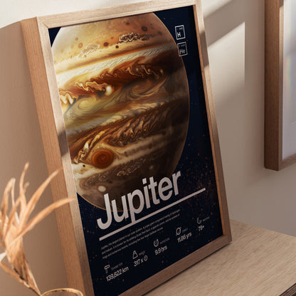 Framed poster of Jupiter featuring detailed equatorial bands and the Great Red Spot, displayed on a wooden surface with sunlight casting shadows. Text includes planetary information and name.