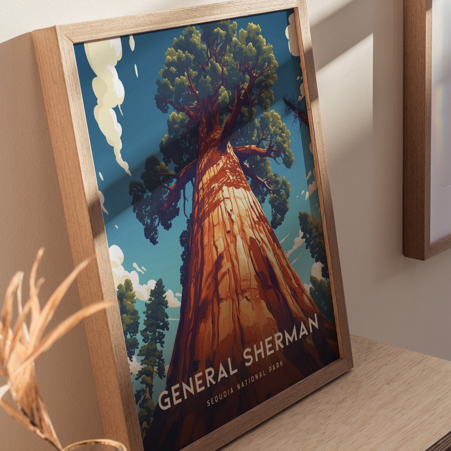 A framed poster of the General Sherman Tree from Sequoia National Park features a towering tree against a blue sky with clouds. The artwork emphasizes the trees majestic height.