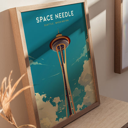 Framed poster of the Space Needle in Seattle, Washington, featuring a vintage travel art style with a blue sky and clouds background, leaning against a wall.