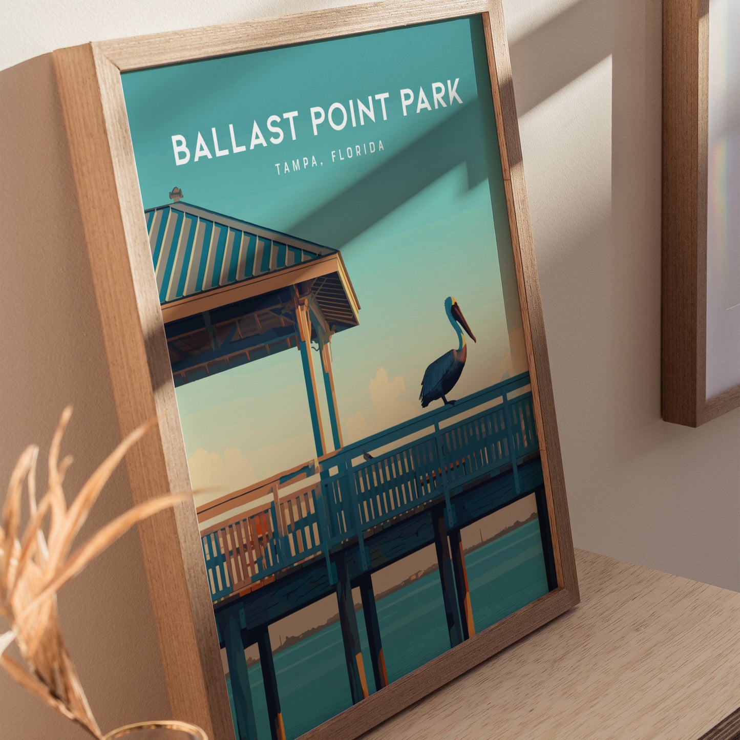 Framed poster of Ballast Point Park, Tampa, Florida, featuring a pelican on a fishing pier under a blue sky.