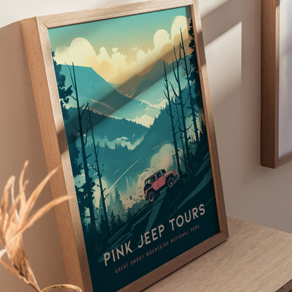 A framed poster depicts a pink jeep navigating through a stylized, misty landscape of the Great Smoky Mountains, surrounded by trees and mountains under a cloudy sky. The text reads Pink Jeep Tours, Great Smoky Mountains National Park.