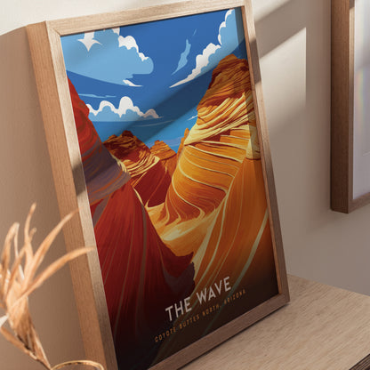 Framed poster featuring vibrant, swirling sandstone formations under a blue sky with clouds, labeled The Wave Coyote Buttes North, Arizona, displayed on a wooden surface.