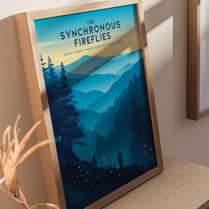 A framed poster titled The Synchronous Fireflies depicts a serene mountain landscape with silhouettes of trees and small glowing fireflies. The artwork captures a magical evening in the Great Smoky Mountains National Park.