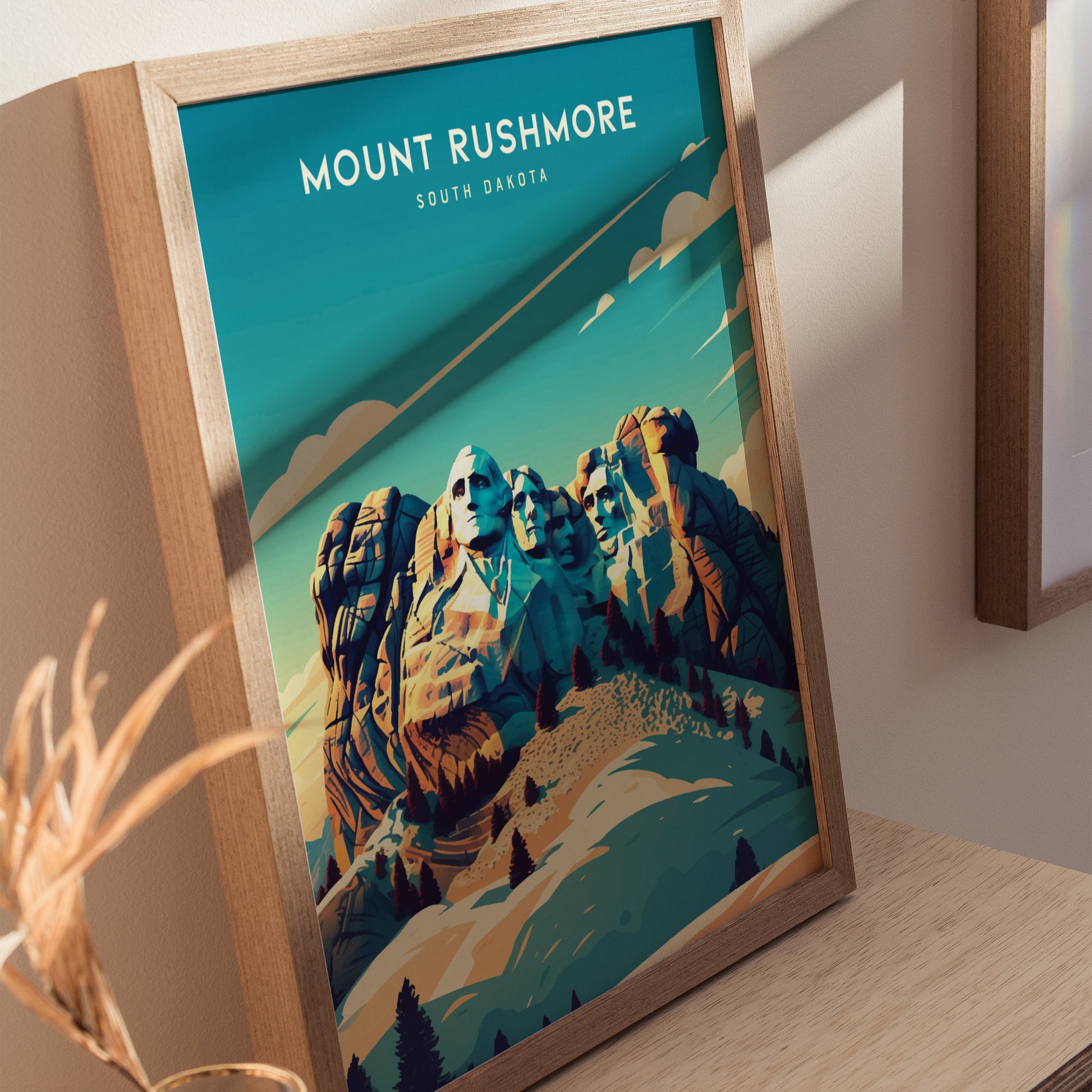 Framed Mount Rushmore poster showcasing the iconic granite carvings against a vibrant blue sky, set on a wooden surface with warm lighting.