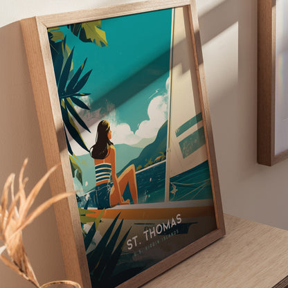 Framed artwork of a woman sitting on a sailboat, gazing at turquoise waters and lush green mountains, with text reading St. Thomas U.S. Virgin Islands.