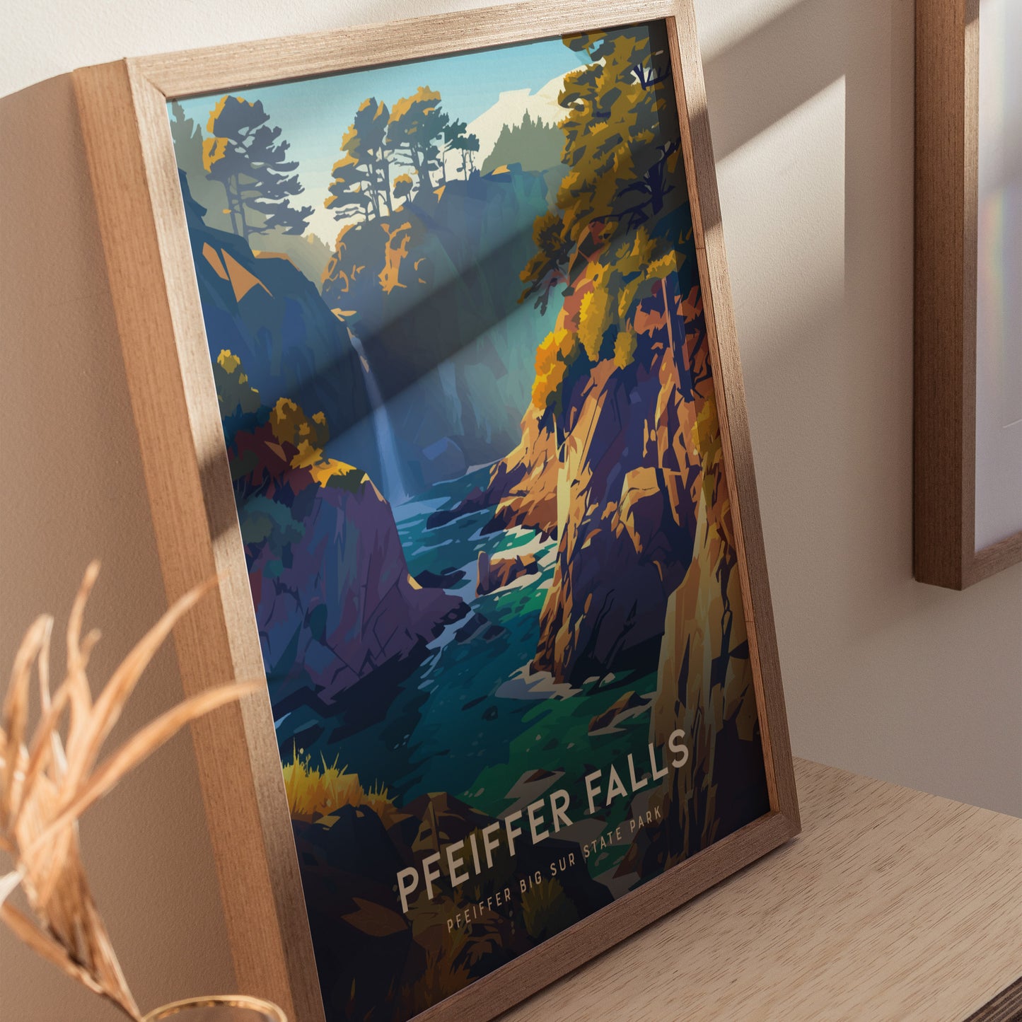 Framed art print depicting a colorful illustration of Pfeiffer Falls, featuring a waterfall flowing through a lush canyon, with vibrant trees and rocky cliffs.