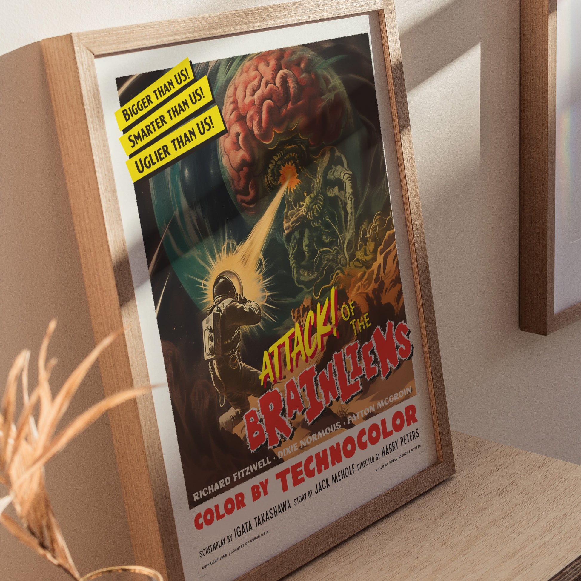 Home decor showing framed and unframed wall art posters depicting chaotic alien invasion and retro sci-fi elements.