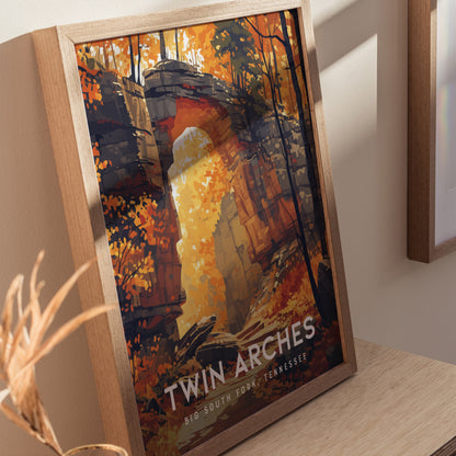 Framed poster featuring stylized artwork of Twin Arches in autumn, with vibrant orange and yellow foliage. The text reads Twin Arches, Big South Fork, Tennessee.