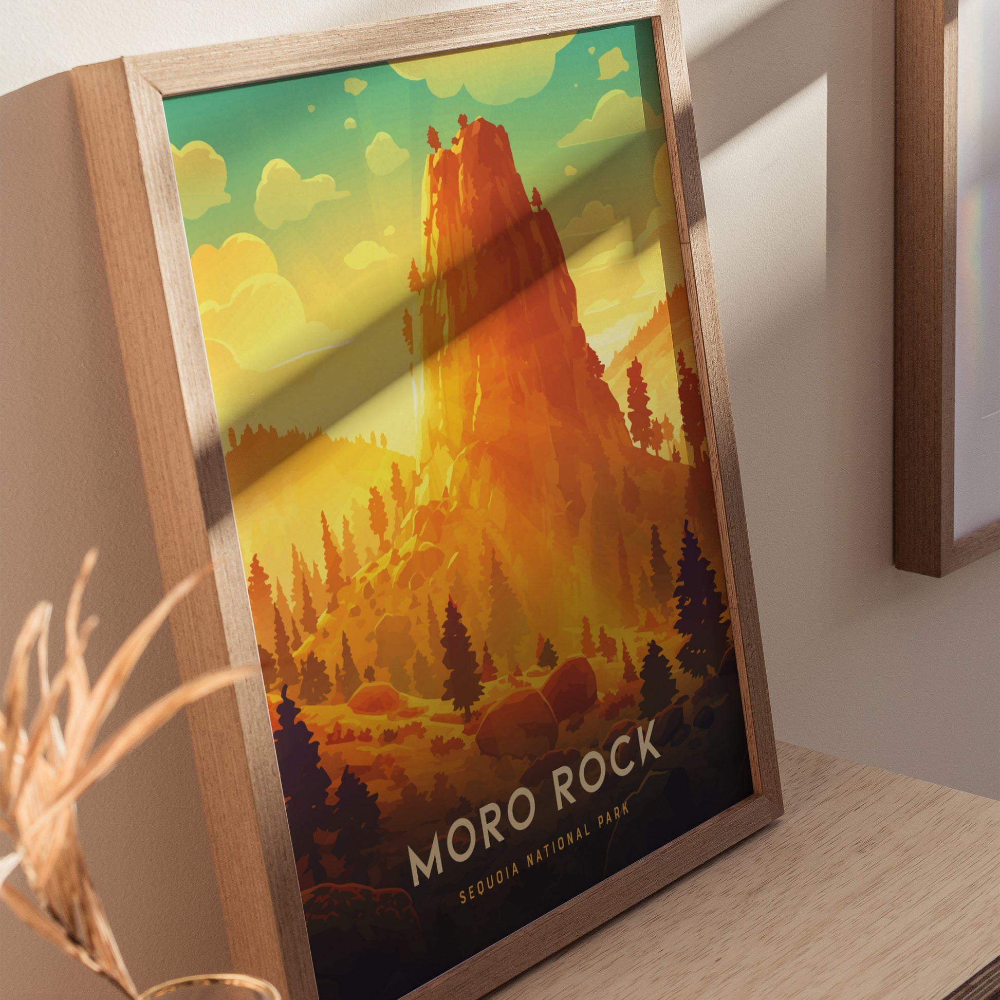 Framed poster depicting Moro Rock in vibrant orange and yellow hues, set against a backdrop of silhouetted trees and a bright sky, labeled Moro Rock Sequoia National Park.